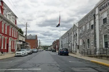 A street lined with historic stone and brick buildings in the Middletown area.