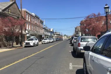 A storefront-lined street in Newtown Borough.