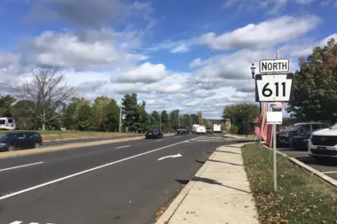 A broad roadway and commercial corridor in Warminster Township.